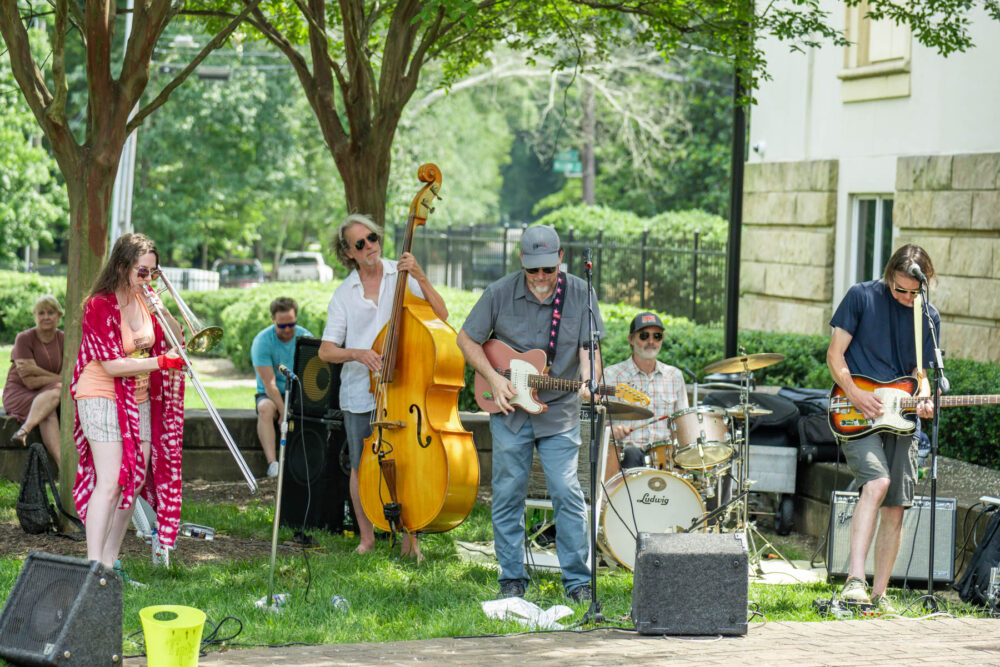 Group of musicians playing at Party in the Park in front of Mint Museum Randolph