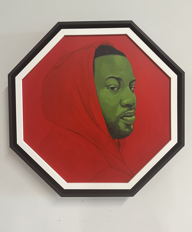 Work of art depicting a man in a red hoodie.